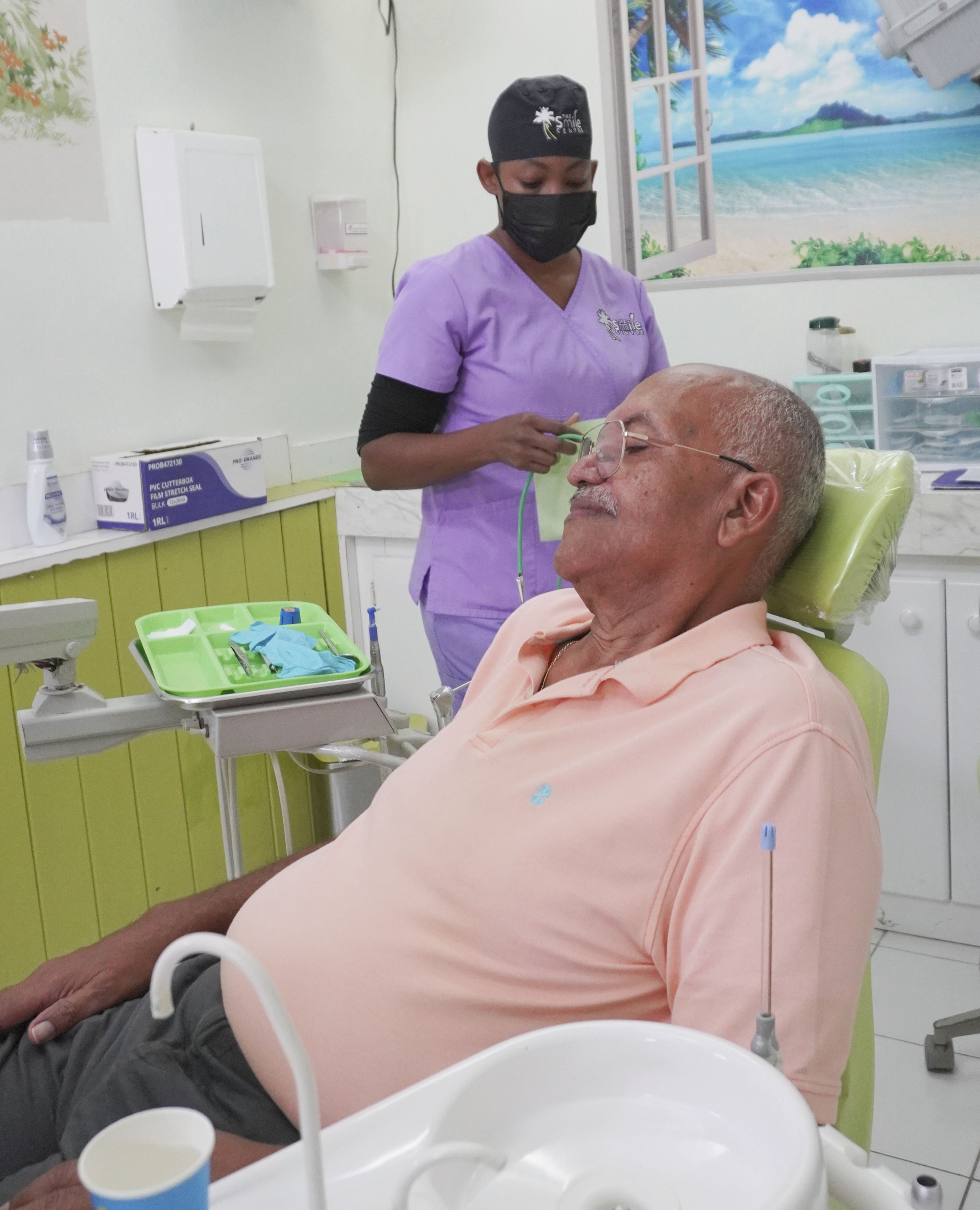 Customer being prepared before his checkup